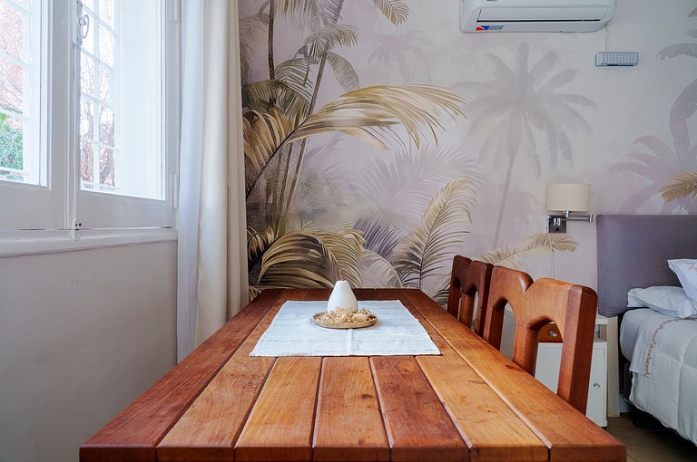 Room with private bathroom and view of a garden.
