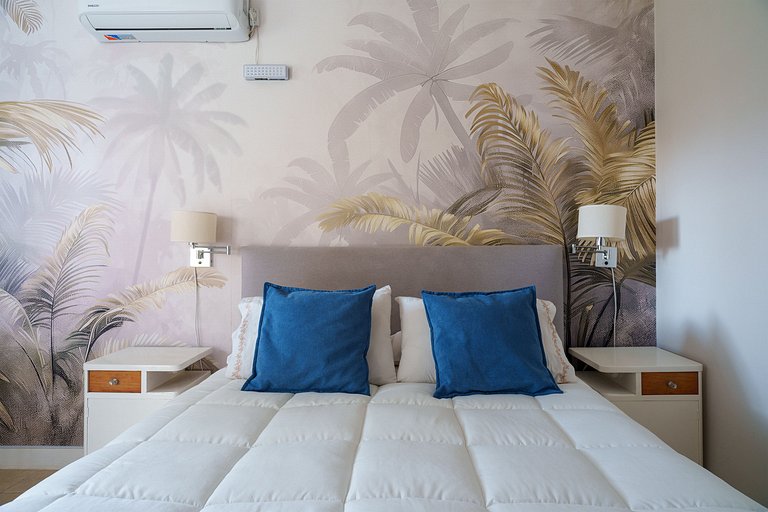 Room with private bathroom and view of a garden.